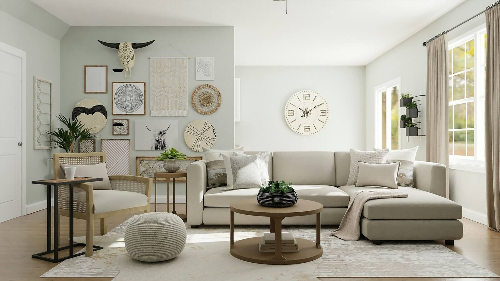 A staged living room with a neutral sectional, a round coffee table and soft natural light