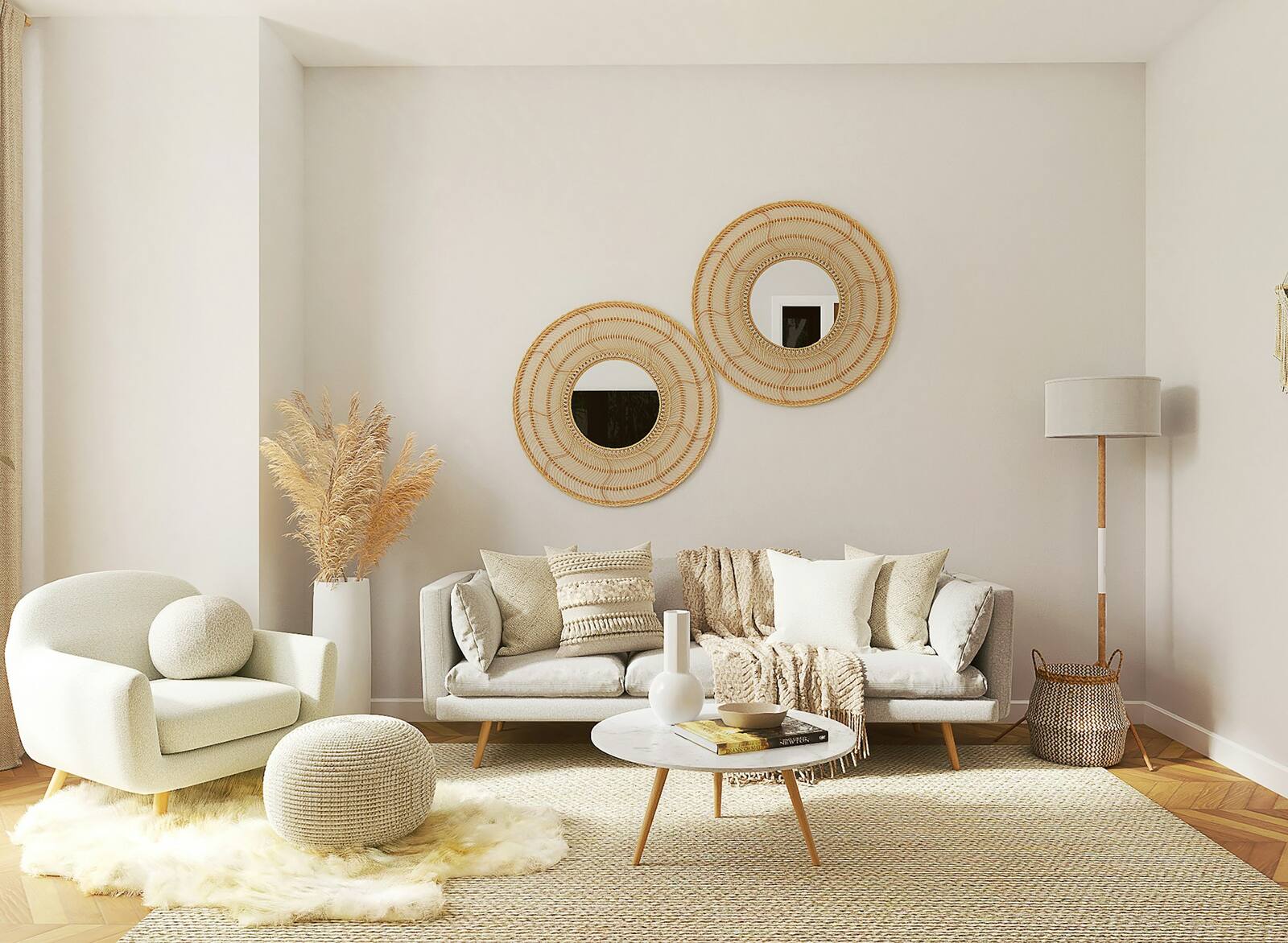 A living room decorated with soft neutrals, woven accents and round mirrors